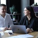 Licensed real estate agent assisting clients with property documents