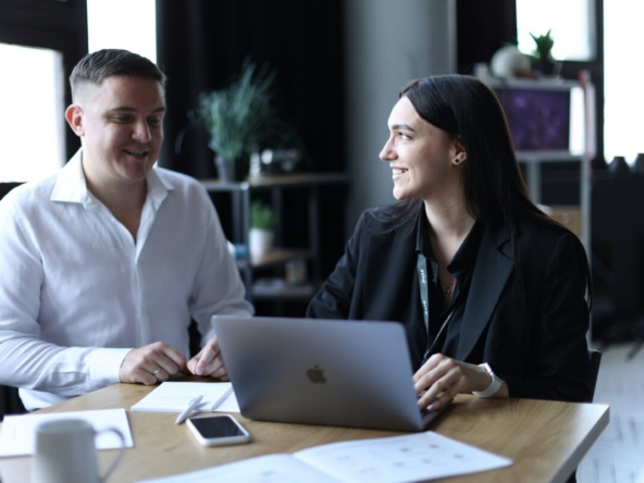 Licensed real estate agent assisting clients with property documents