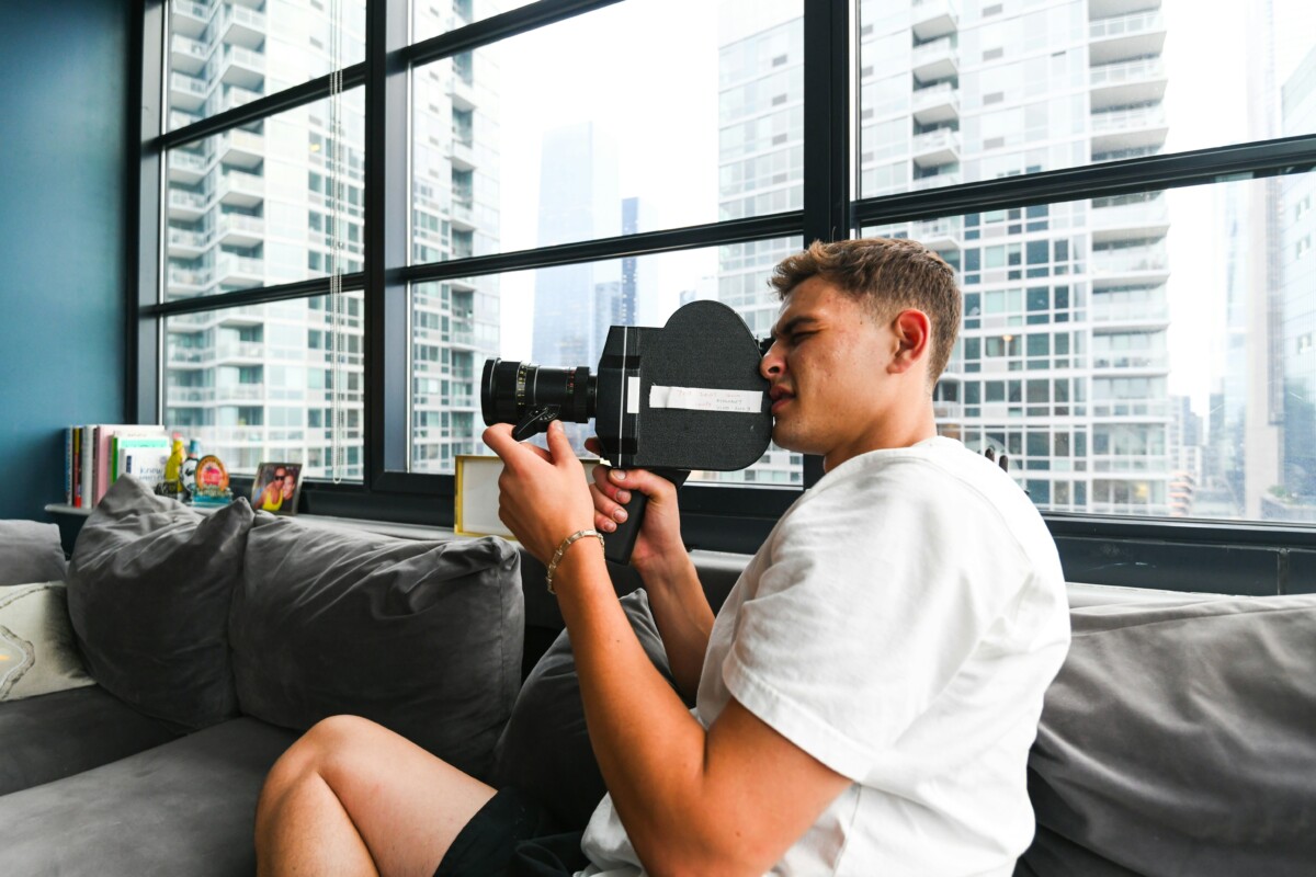 A real estate agent showing an apartment to potential buyers during an in-person viewing
